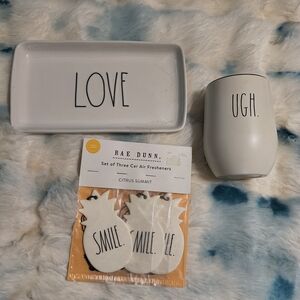 Rae Dunn white ceramic "LOVE" tray, "UGH." tumbler, and pineapple air fresheners
